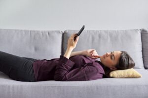 Teacher working with college student individually, woman and teenage girl in black protective masks. Virus prevention, health protection, education concept